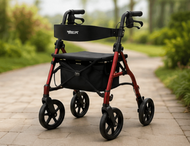Red four-wheeled rollator walker with seat, black backrest, and storage bag