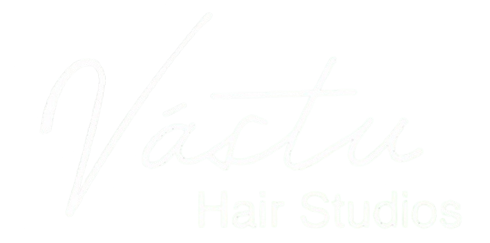 Faint white script logo reading “Vestia” over “Studio” on a white background