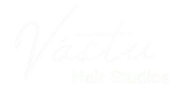 Faint white script logo reading “Vestia” over “Studio” on a white background