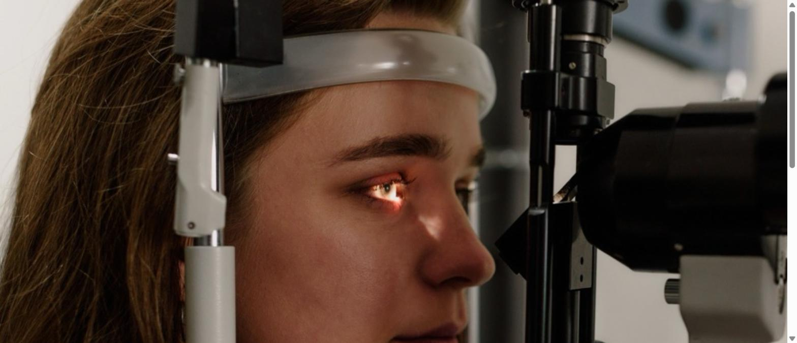 Woman receiving a comprehensive eye exam at an optometrist's office