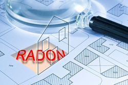 Red “RADON” text over blue architectural floor plans with a pencil and magnifying glass