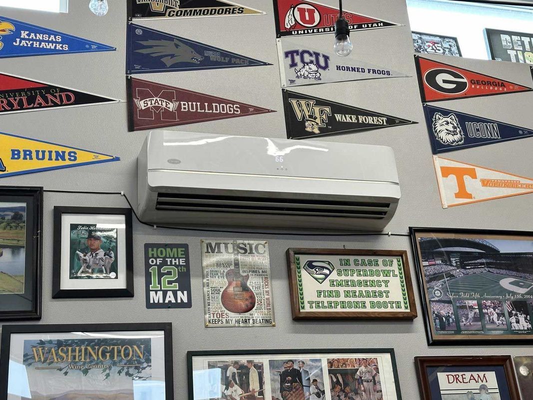 A wall with a lot of pictures and flags on it