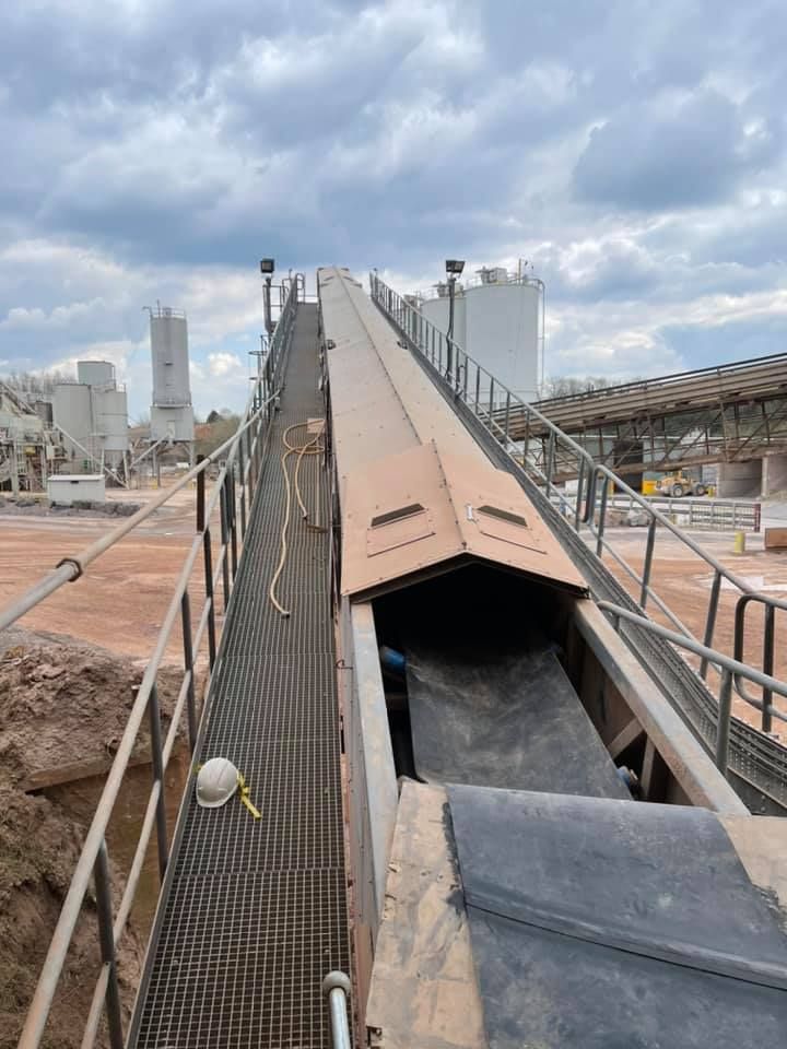 Conveyor Belts At The Construction Site With Cloudy Sky Background — Conveyor Maintenance Services In Mount Isa, QLD