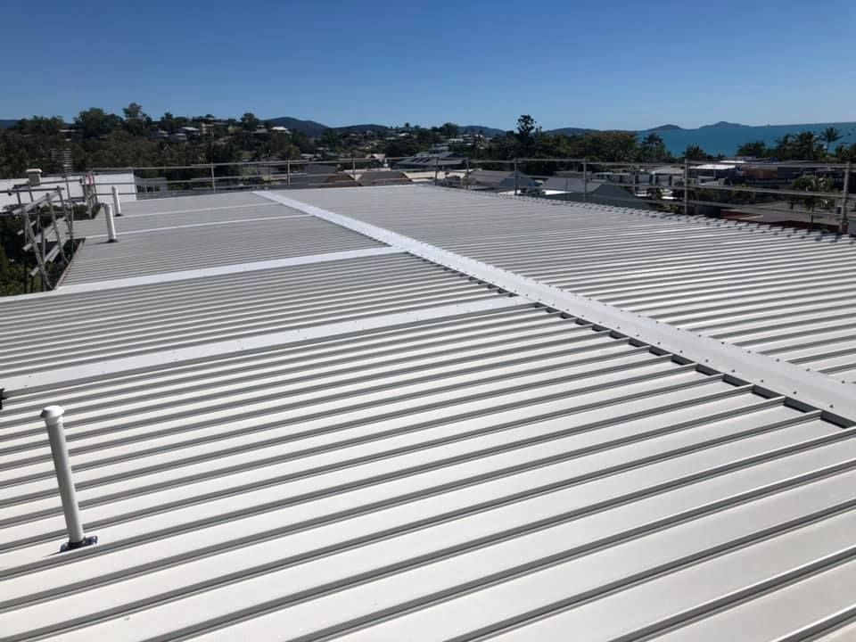 A White Roof With A Blue Sky In The Background — Posty’s Roofing In Cannonvale, QLD