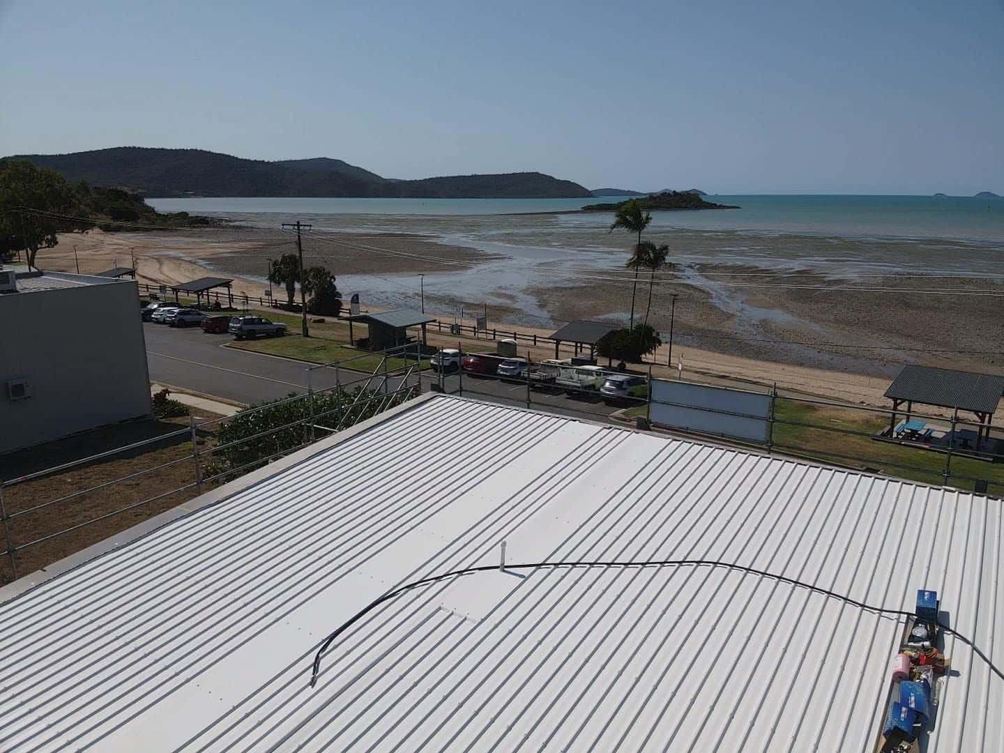 A White Roof With A View Of The Ocean — Posty’s Roofing In Cannonvale, QLD