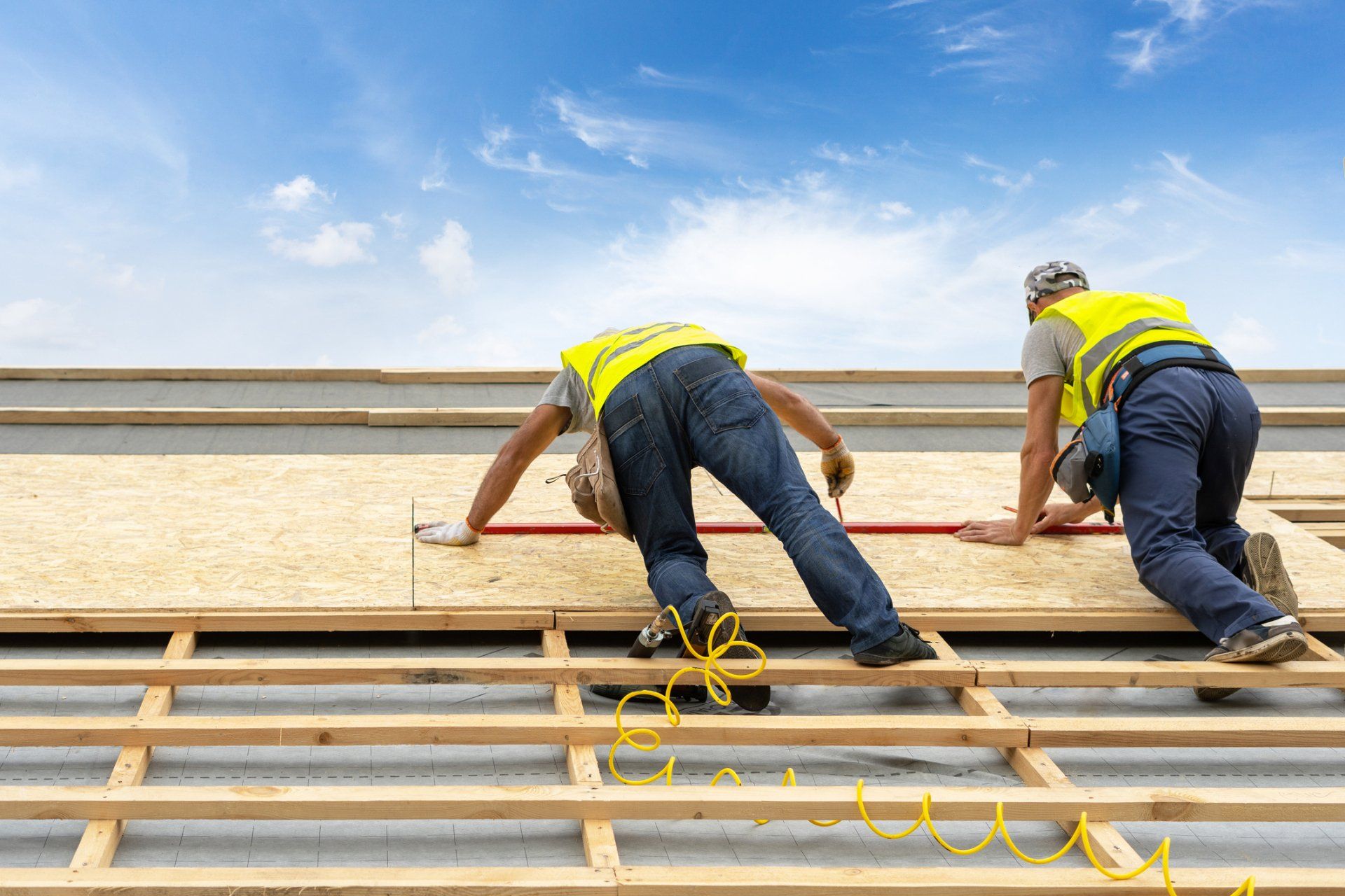 Roofers Measuring the Size of the Roof Cover - St. Charles, MO - Clayton Restoration