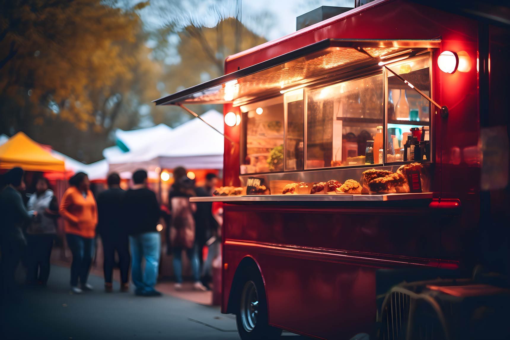 Food truck at night with lights on