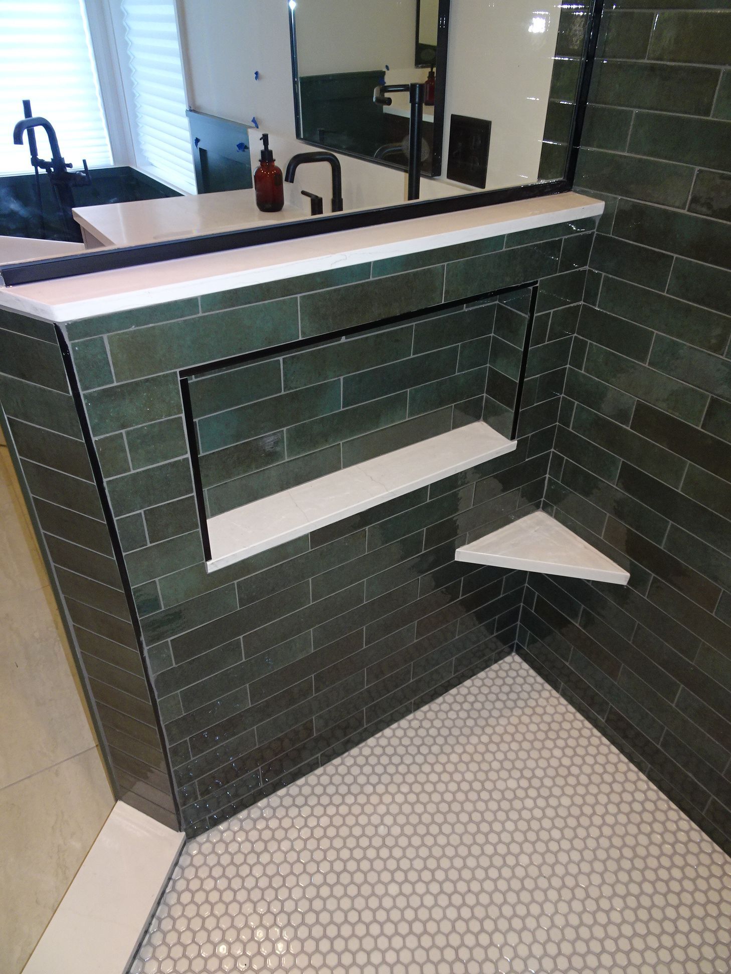 Dark green subway tile surround with black matte faucet and vessel sink vanity, primary bathroom remodel, Eden Prairie, MN