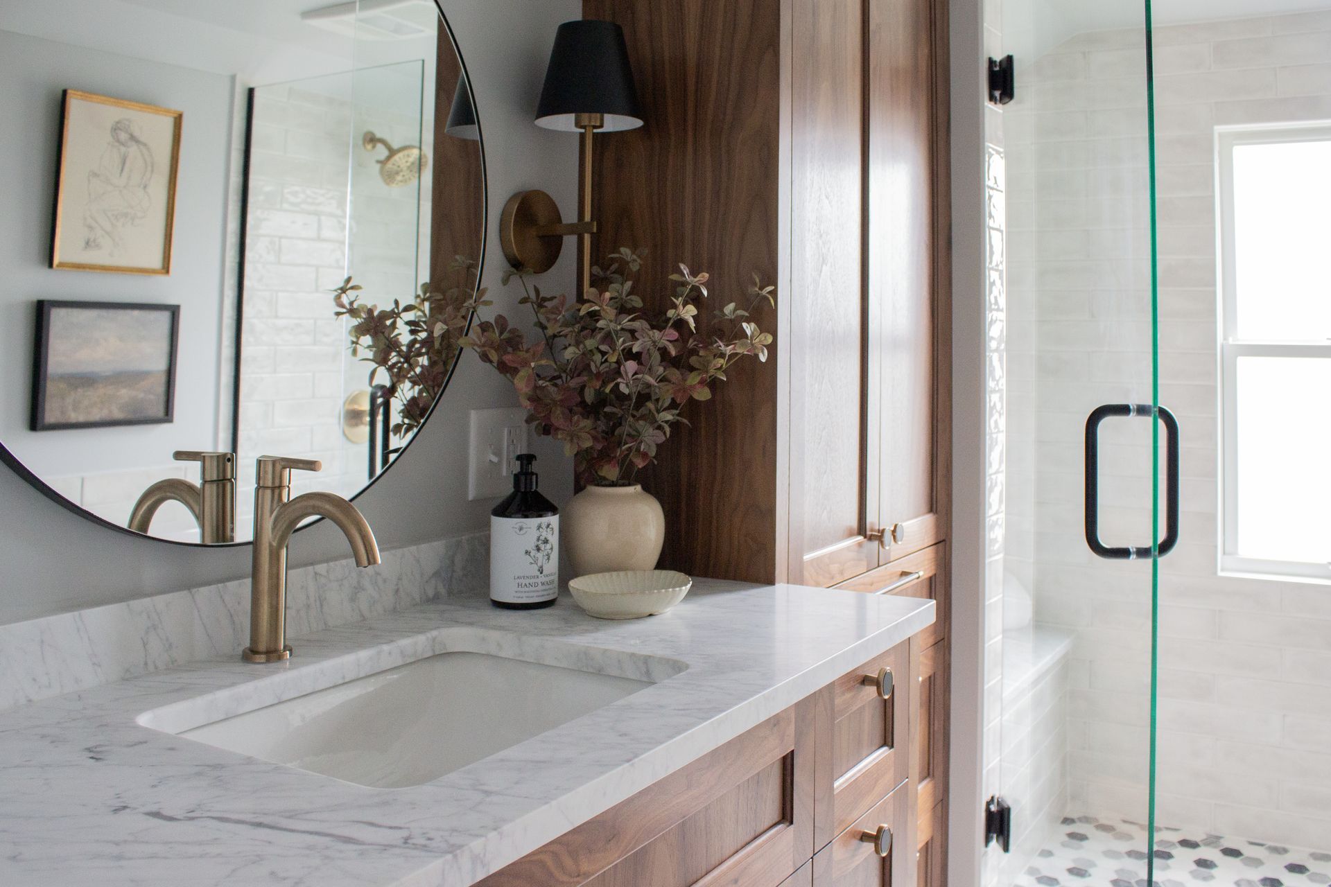 Luxury bathroom renovation in St. Paul with custom vanity, quartz countertop, and glass shower enclosure
