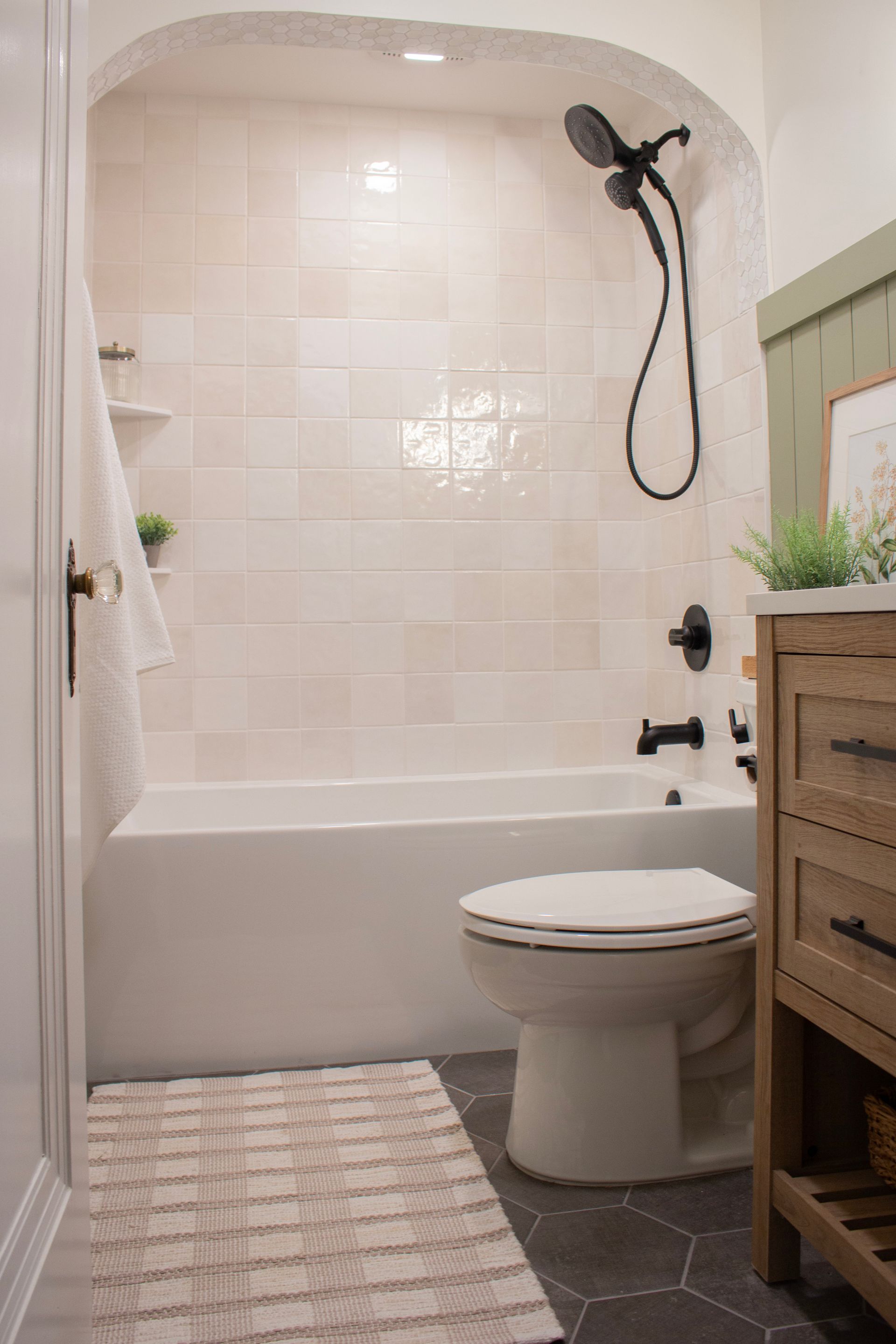 Bathroom remodel in St. Paul, MN showcasing a walk-in shower with custom tile and modern black shower fixture