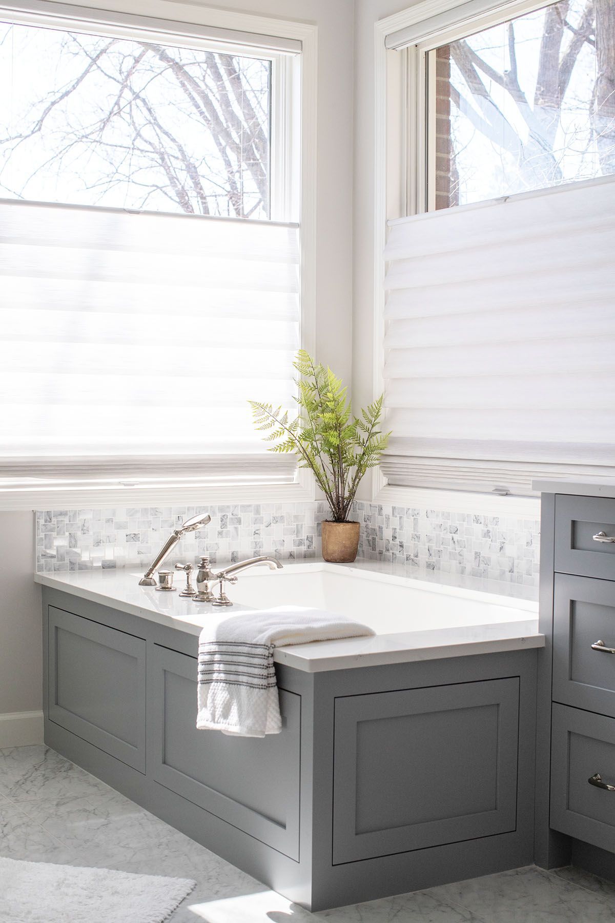 A Bathroom with A Bathtub and A Window.