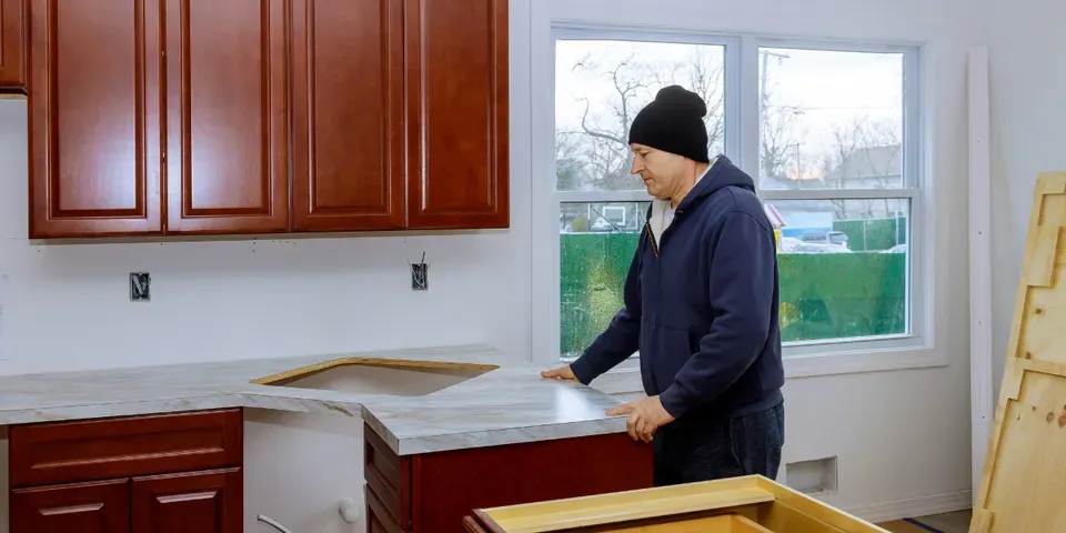 Man Setting Tiles — St. Paul, MN — APEX Design Build Man Setting Tiles — St. Paul, MN — APEX Design Build
