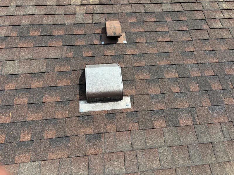 A close up of a roof with a vent on it