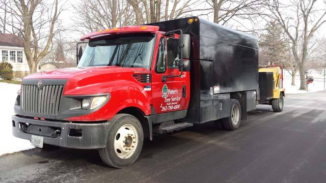 Red Colored Truck — New Berlin, WI — Potter’s Tree Service Red Colored Truck — New Berlin, WI — Potter’s Tree Service