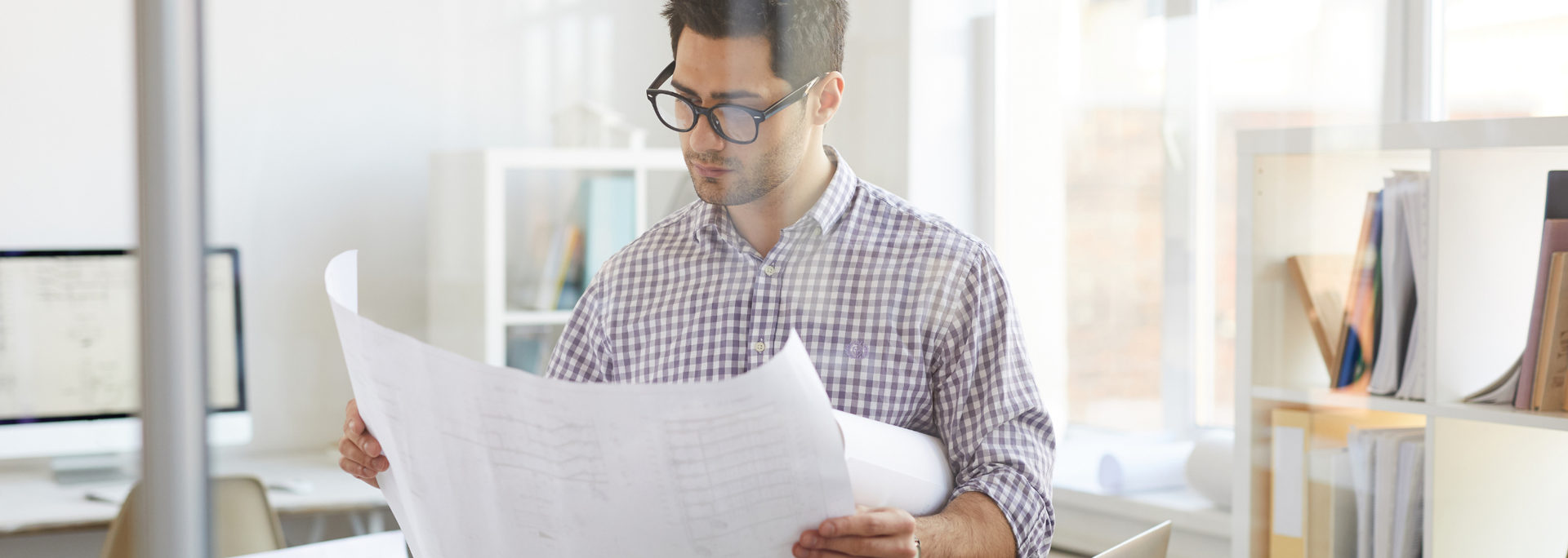 Picture of an architect looking at documents. Picture of an architect looking at documents.