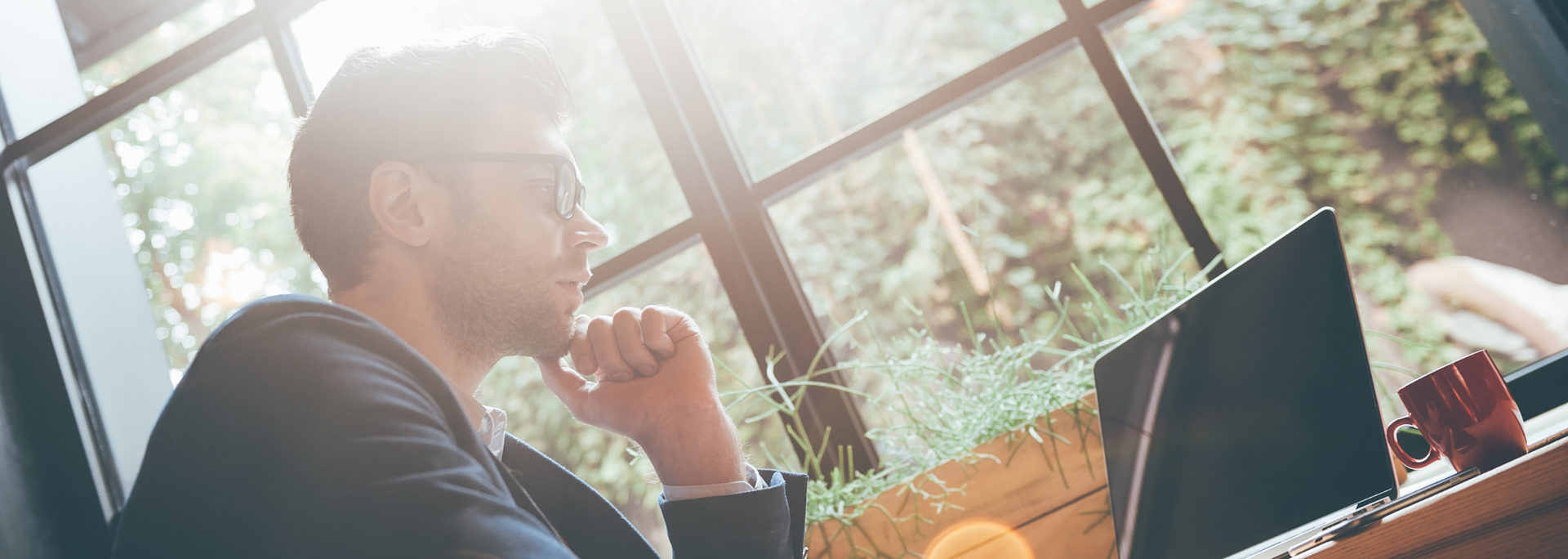 Picture of a person enjoying sunlight through a window. Picture of a person enjoying sunlight through a window.