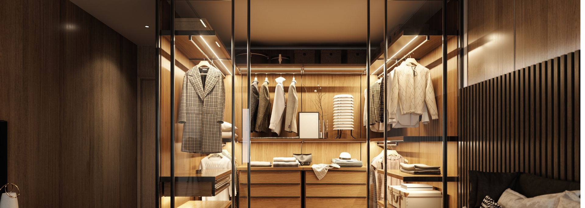 Walk-in closet with glass doors, wood paneling, and lit clothing racks.
