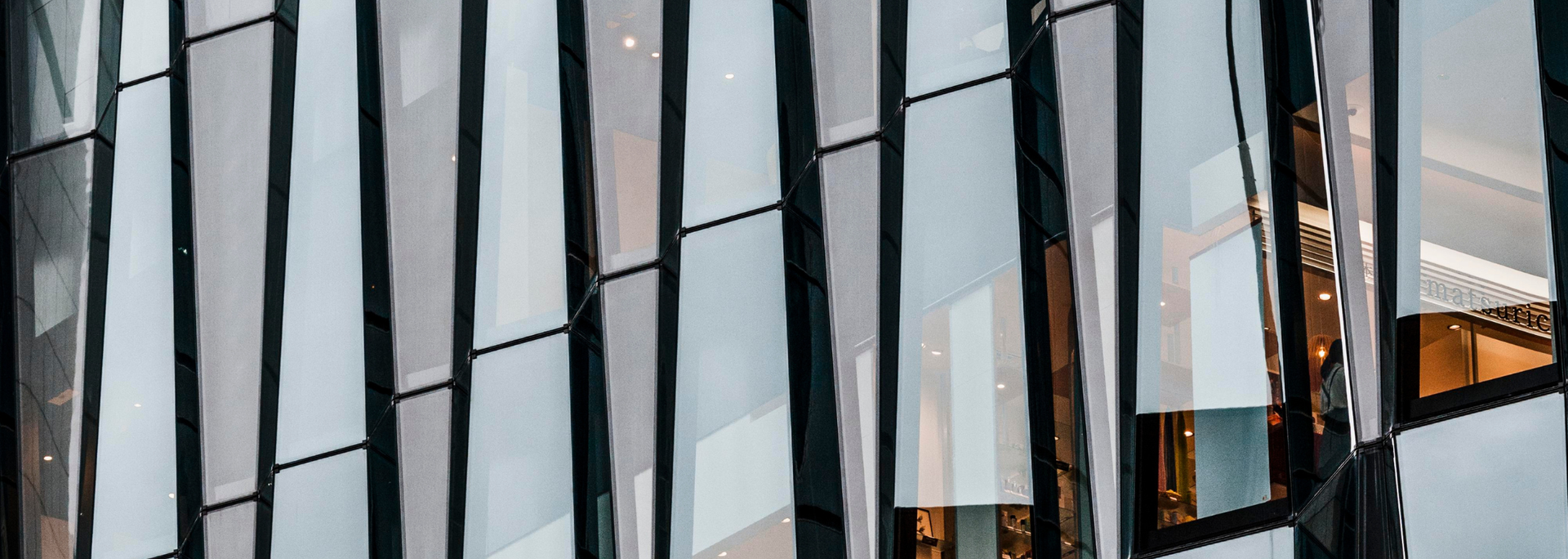 Modern building facade with reflective glass panels.