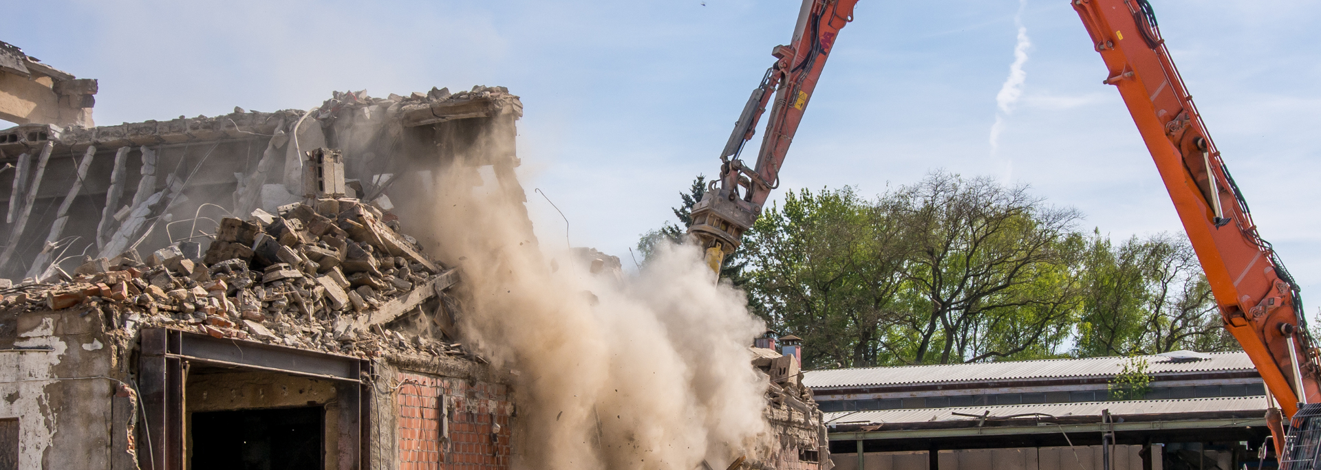 Picture of a building being demolished. Picture of a building being demolished.
