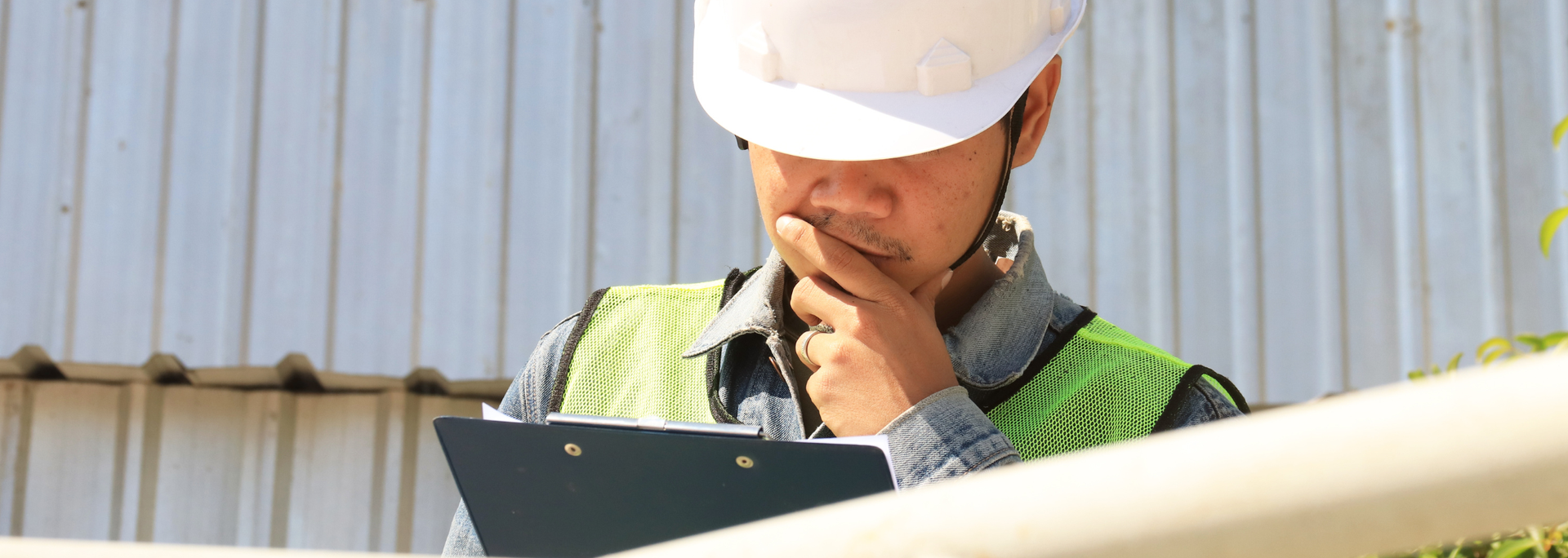 Picture of someone looking at a clipboard. Picture of someone looking at a clipboard.