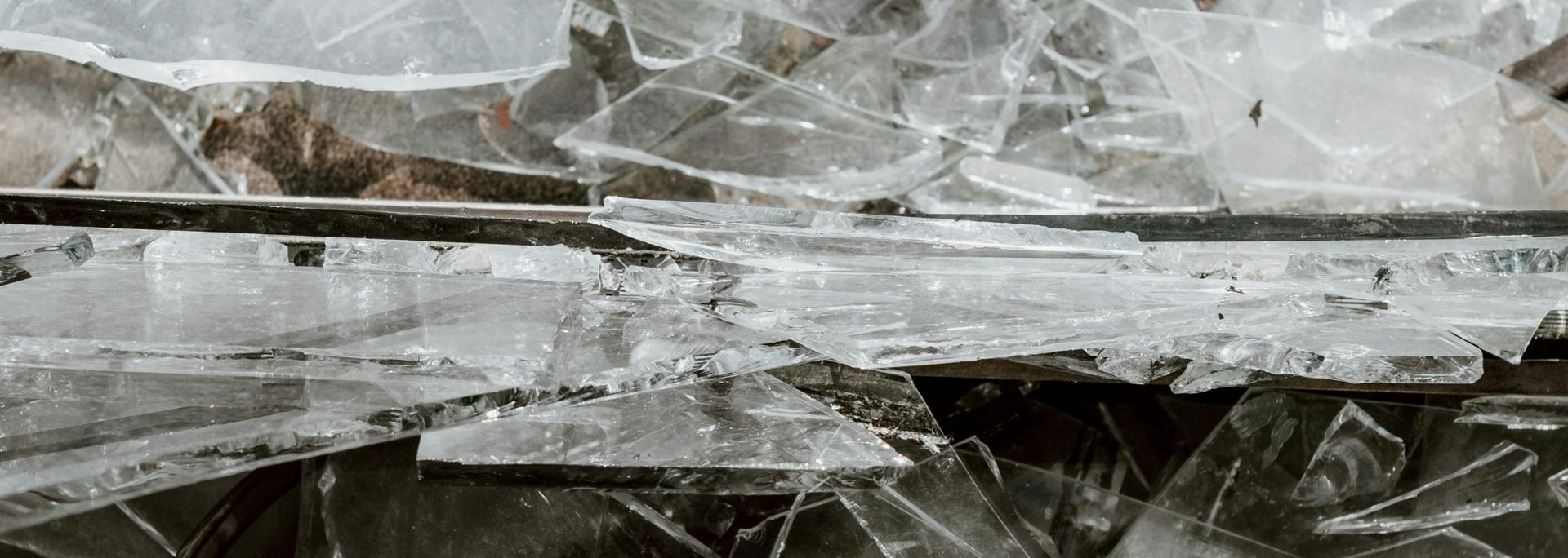 Shattered glass on a black surface.