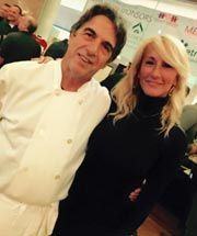 A man and a woman are posing for a picture together in a restaurant.