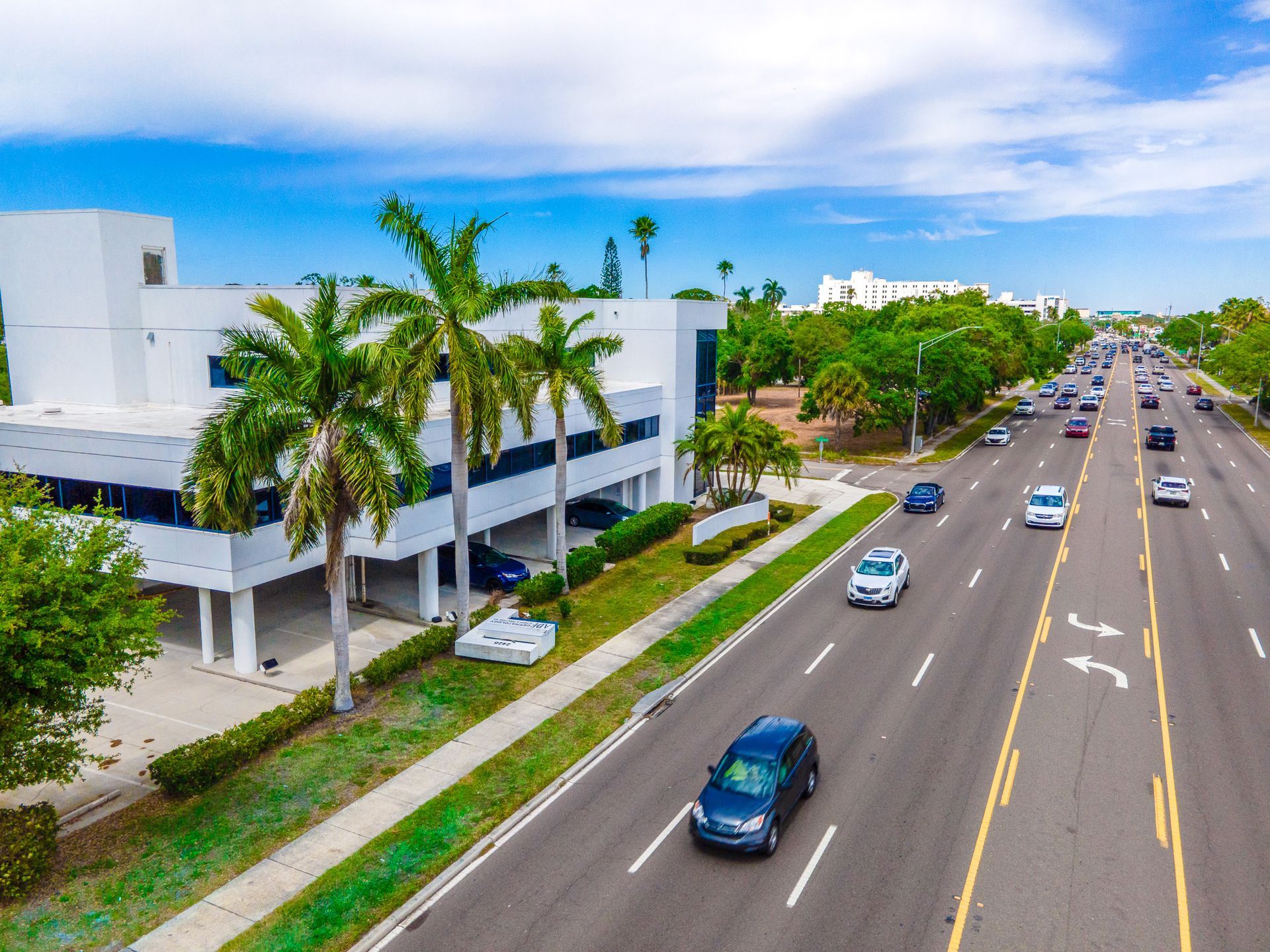 An aerial view of a highway with cars driving down it