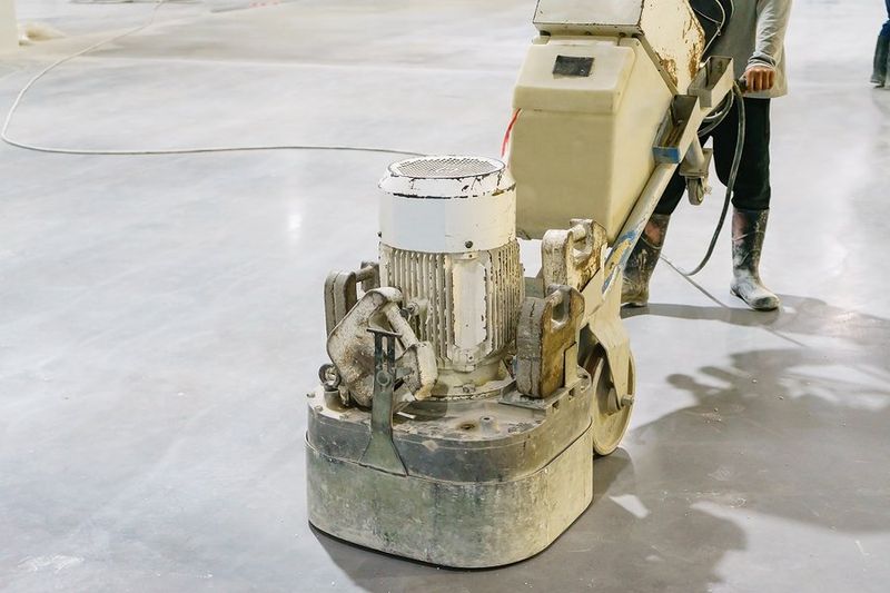 worker flattens the concrete
