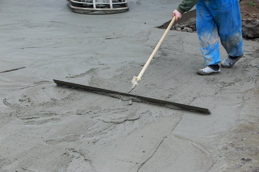 worker scraping the cement