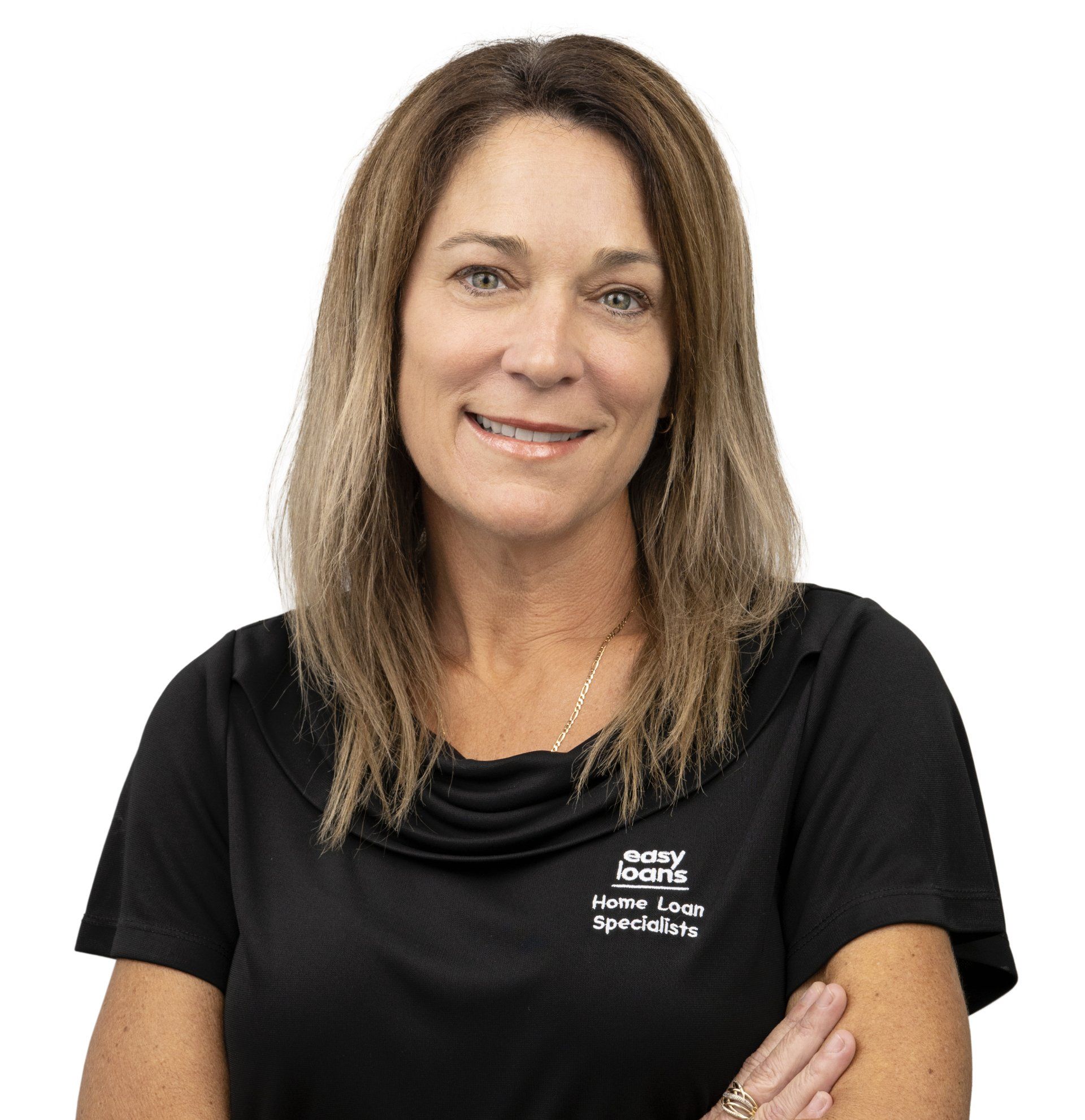 A woman in a black shirt is smiling with her arms crossed.