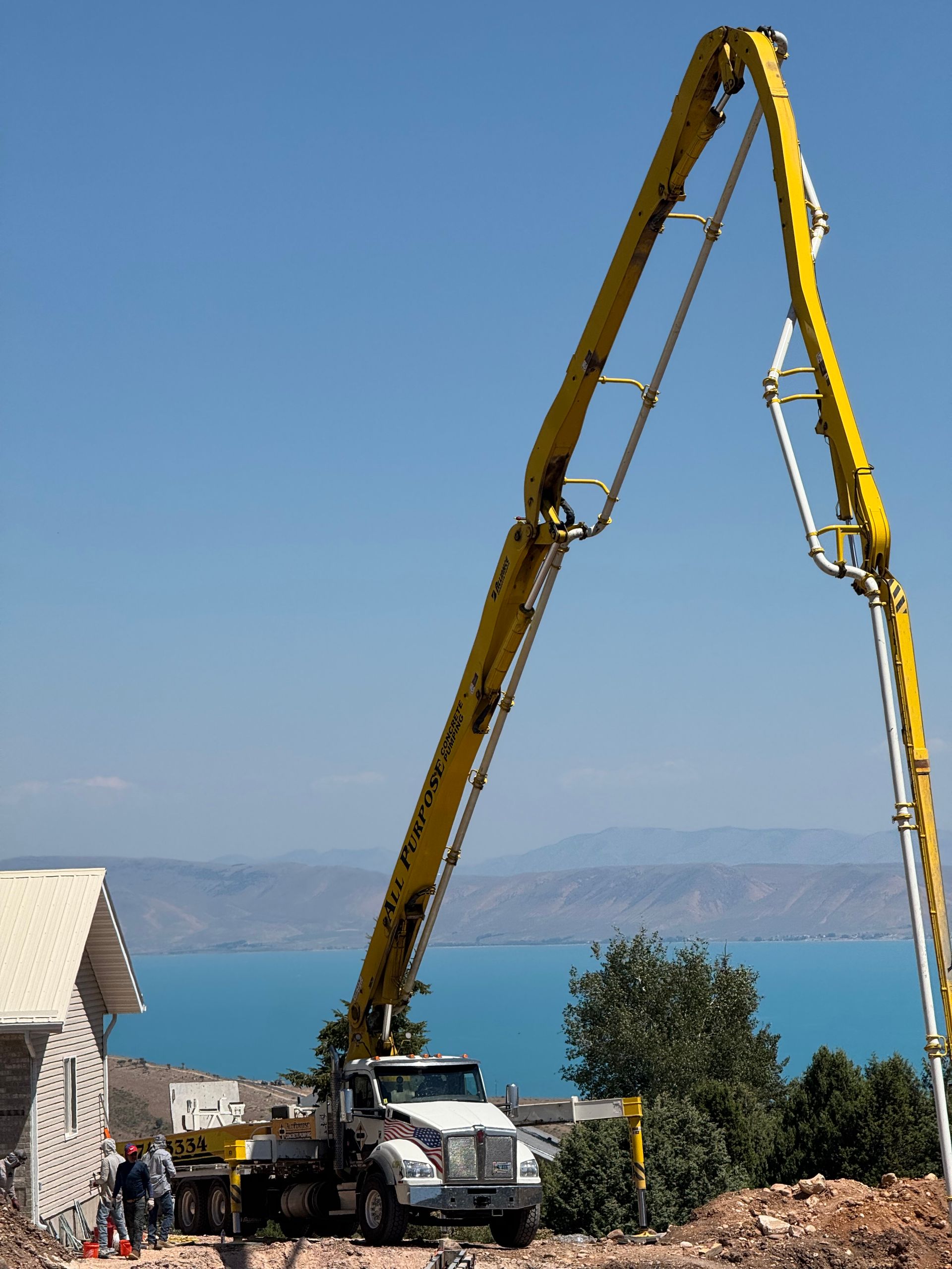 A concrete foundation is being built with wooden forms and steel bars.