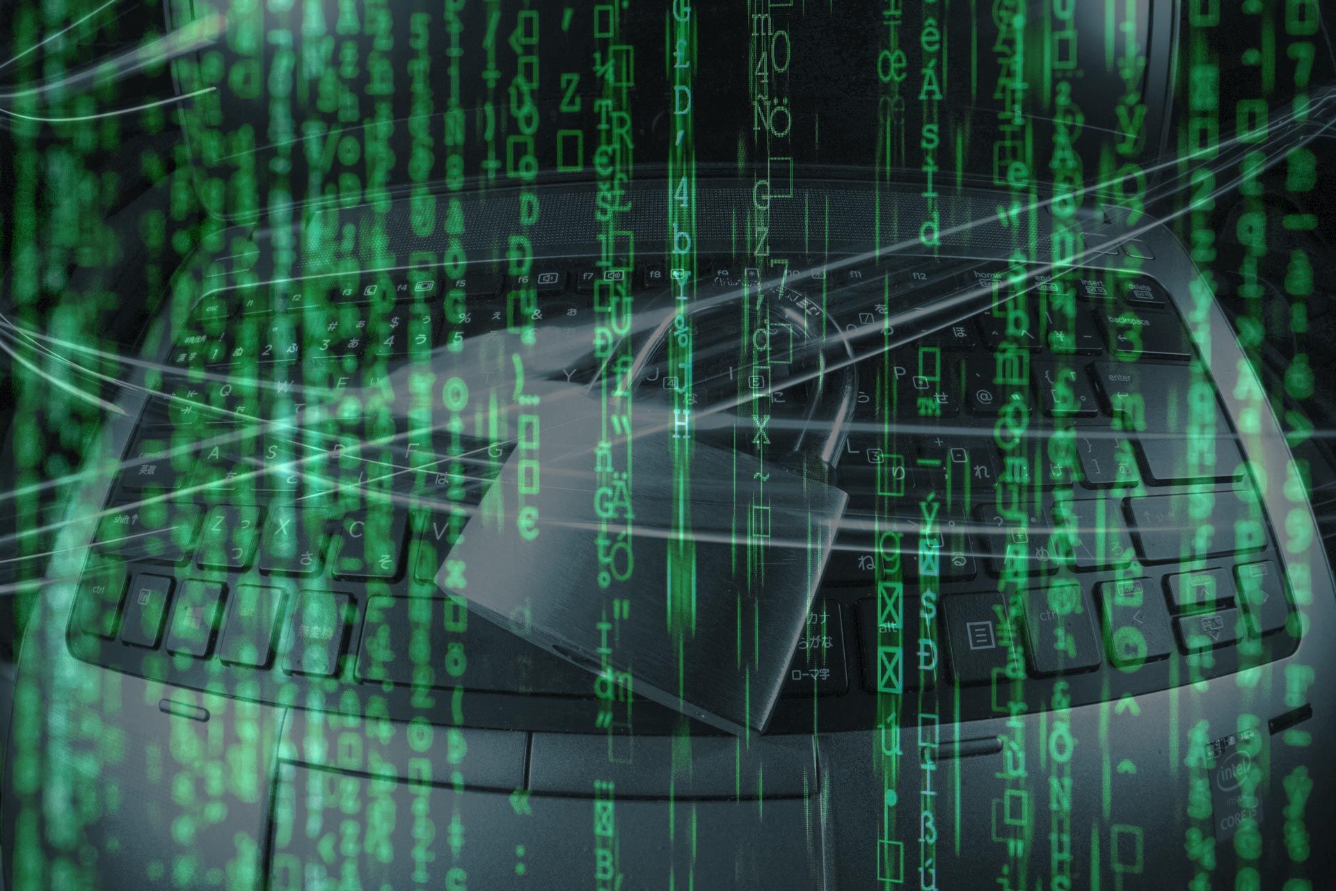 laptop with lock on keyboard and lines of data streaming on top of it for job search cybersecuity