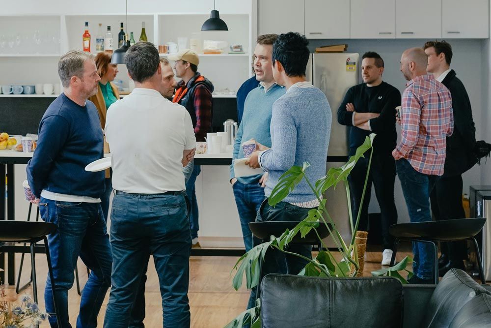 Business group meeting with members and guests networking but one person wants to leave gracefully