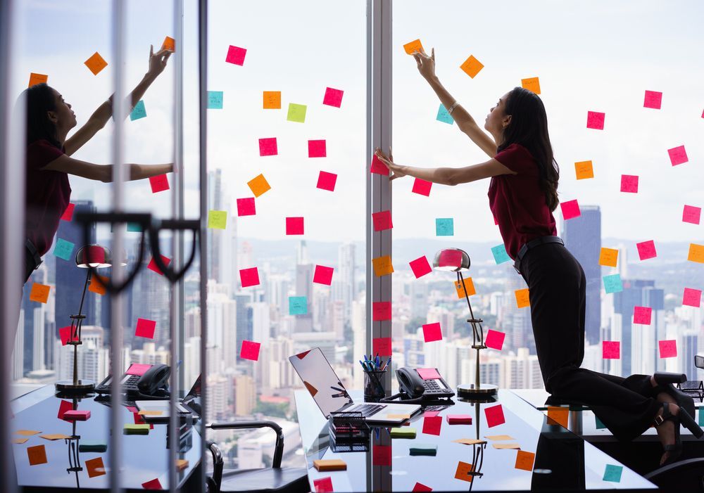Executive getting ready to plan an organized job search after trying using sticky notes for tracking