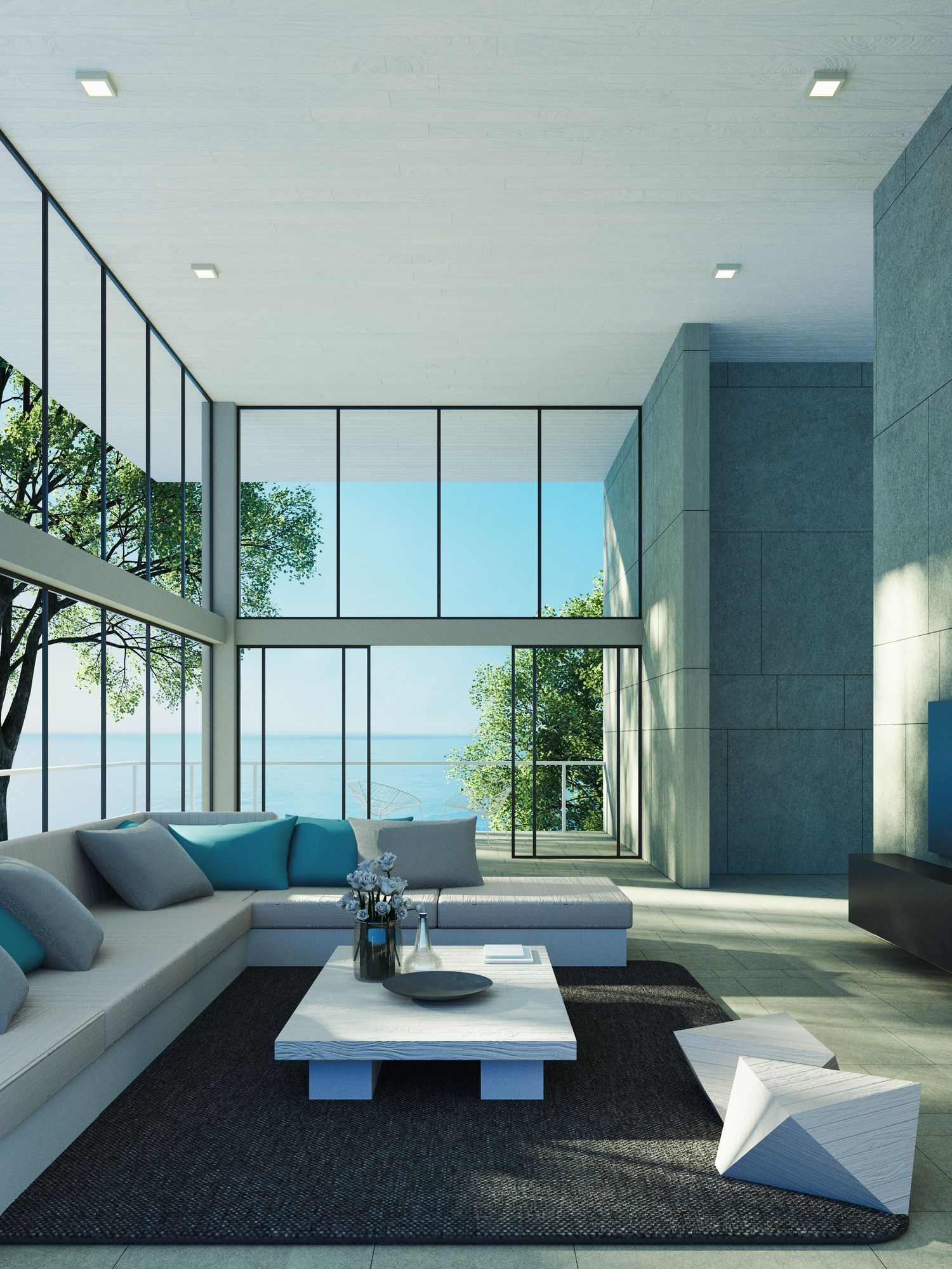 Modern white living room with a beige sectional sofa, arched windows, and a geometric patterned armchair.
