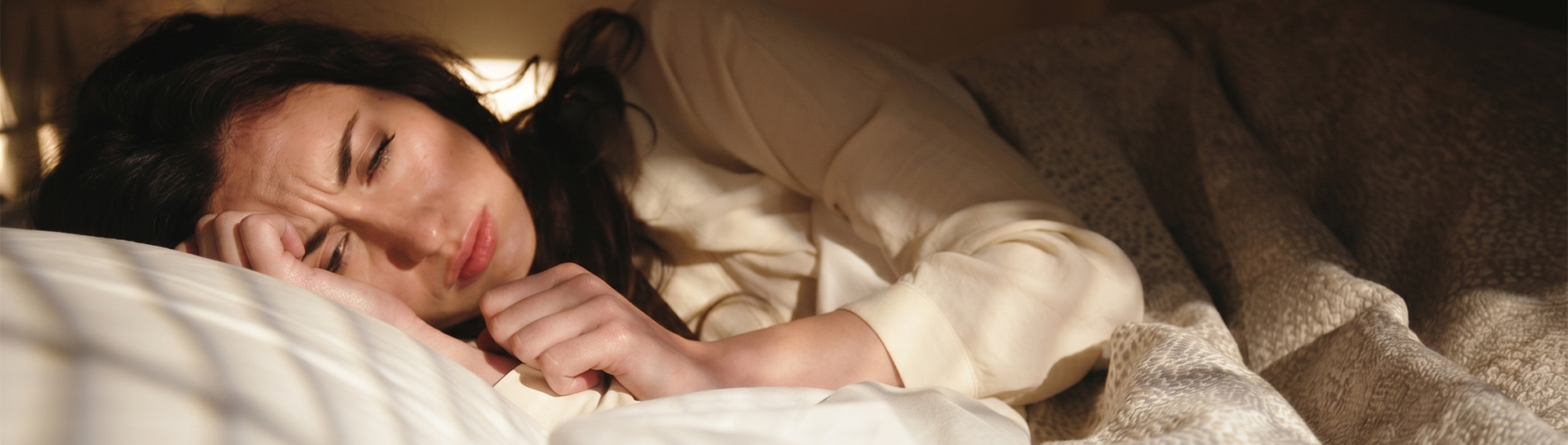 Tired woman trying to sleep
