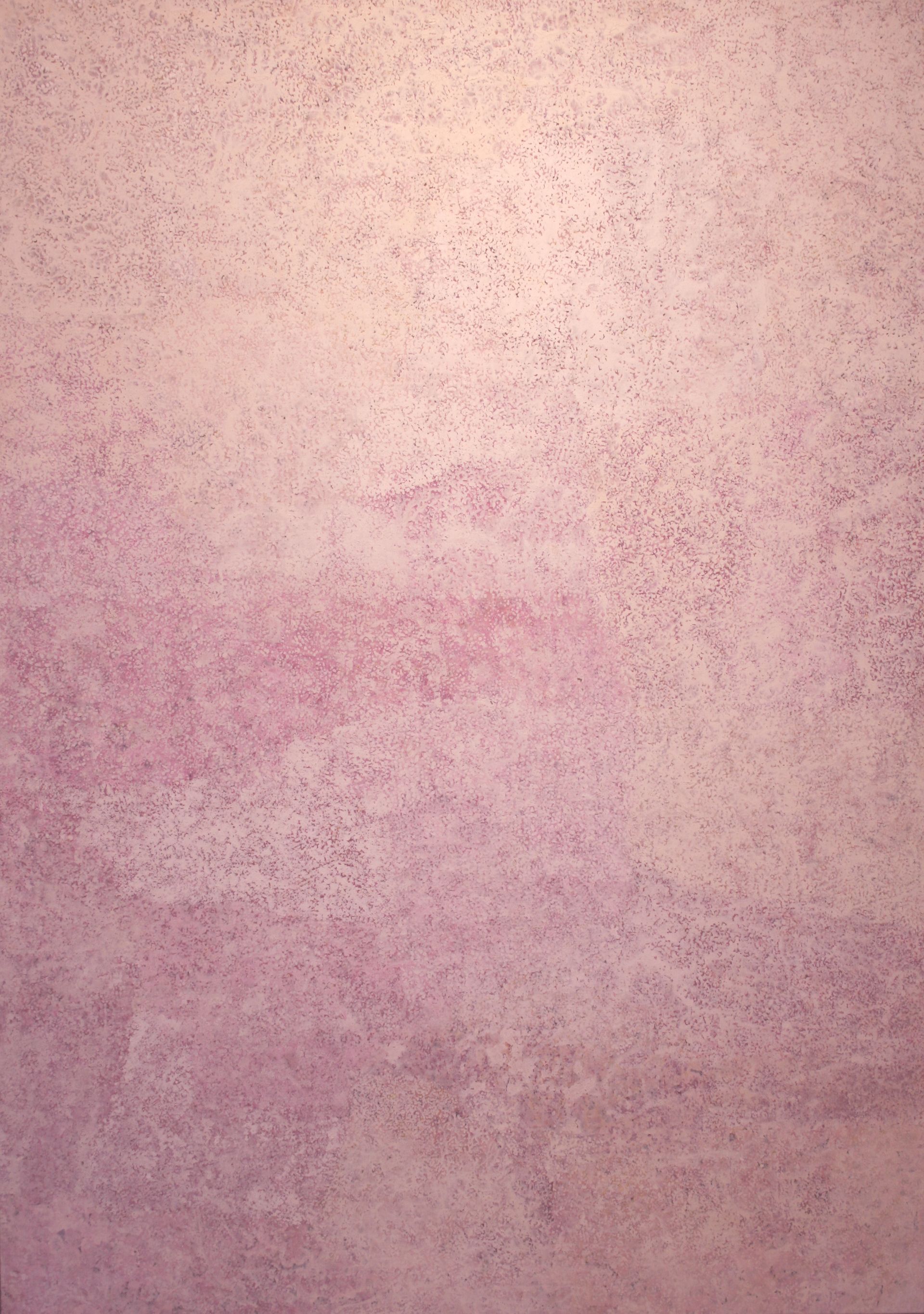 A close up of a purple wall with a texture.