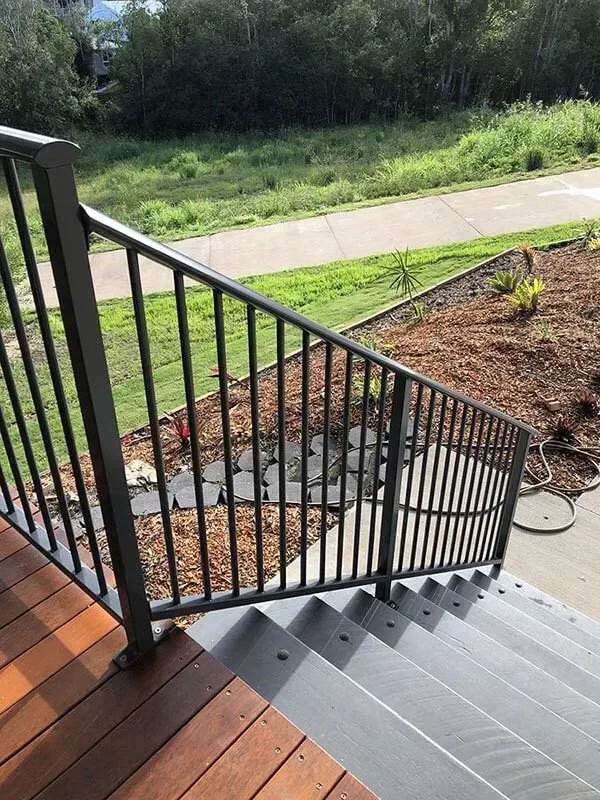 A Set of Stairs Leading Up to a Deck With a Metal Railing — Sunshine Gates in Kunda Park, QLD