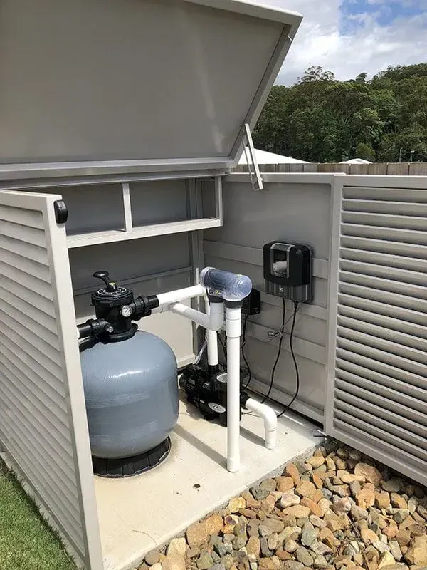 A Pool Filter is Sitting Inside of a Shed — Sunshine Gates in Kunda Park, QLD