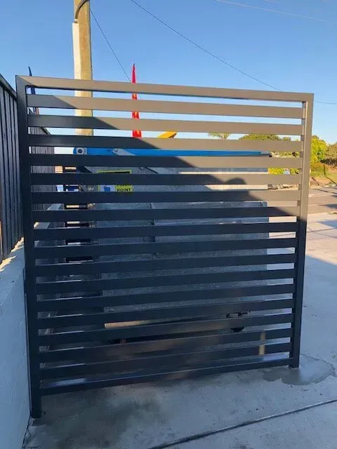 A Fence With a Car Parked Behind It — Sunshine Gates in Kunda Park, QLD