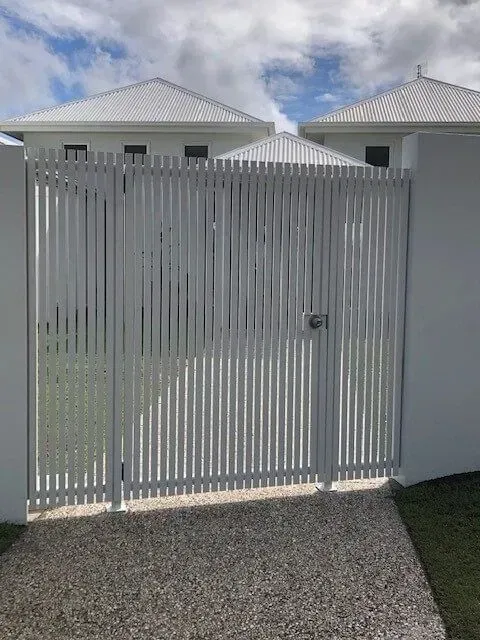 A White Gate is Sitting in Front of a White House — Sunshine Gates in Kunda Park, QLD