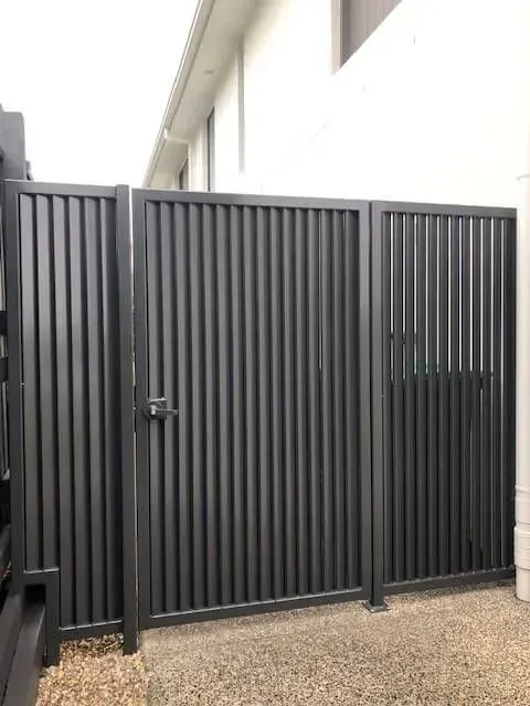 A Black Metal Gate is Sitting in Front of a House — Sunshine Gates in Kunda Park, QLD