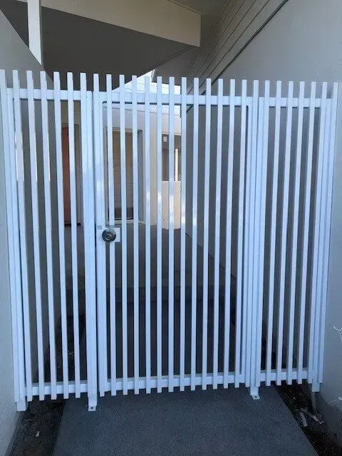 A White Fence With a Door That is Open — Sunshine Gates in Kunda Park, QLD