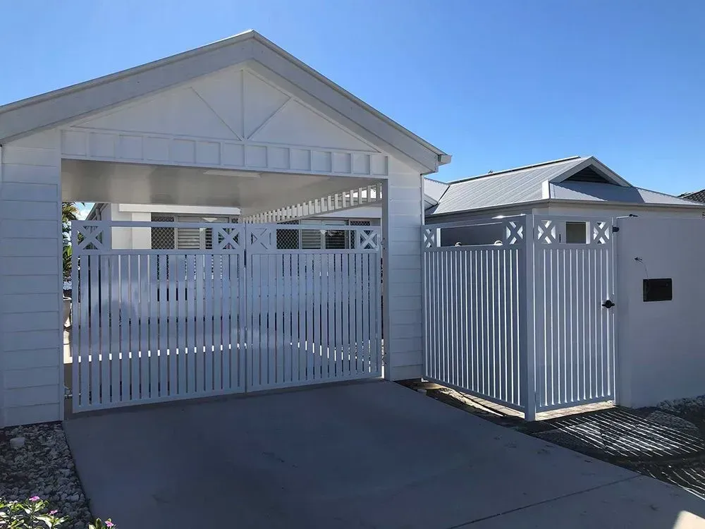 A White House With a Carport and a Gate in Front of It — Sunshine Gates in Kunda Park, QLD