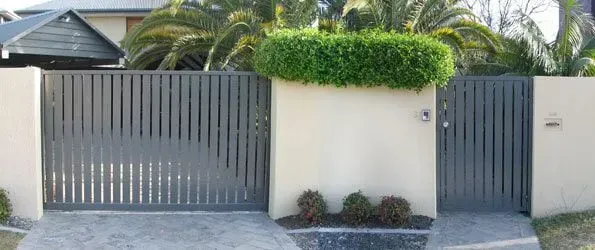 A House With a Fence and a Gate in Front of It — Sunshine Gates in Kunda Park, QLD