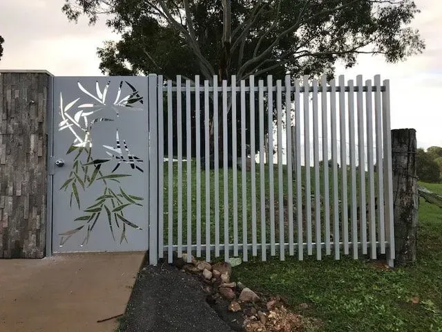 A Gate With a Bamboo Design on It is Surrounded by a Fence — Sunshine Gates in Kunda Park, QLD