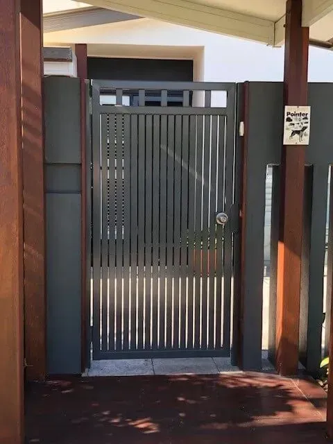 A Gate With a Sign on It That Says No Dogs Allowed — Sunshine Gates in Kunda Park, QLD