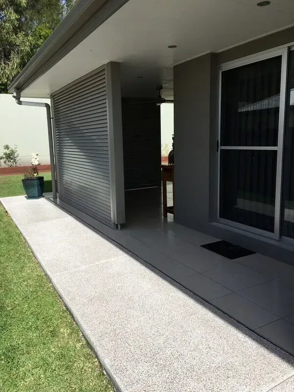 A Walkway Leading to a House With a Sliding Glass Door — Sunshine Gates in Kunda Park, QLD
