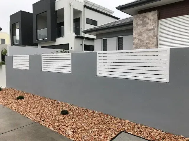 A Gray Wall With a White Fence in Front of a House — Sunshine Gates in Kunda Park, QLD