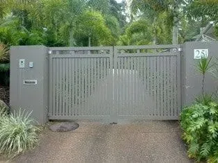 A Sliding Gate is Open to a Driveway in Front of a House — Sunshine Gates in Kunda Park, QLD